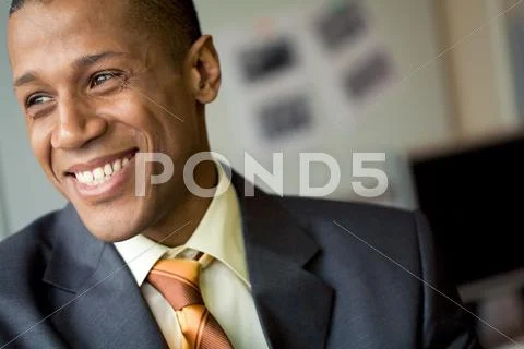 Portrait of cheerful professional looking aside and laughing Stock Photos