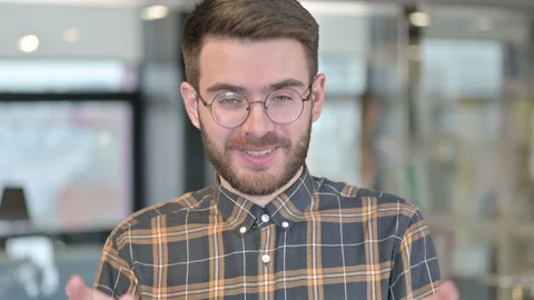 Portrait of Cheerful Young Designer doing Video chat and Waving Stock Footage 119342001