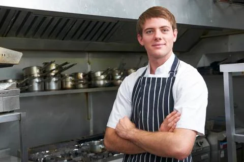 Portrait of chef in kitchen Stock Photos