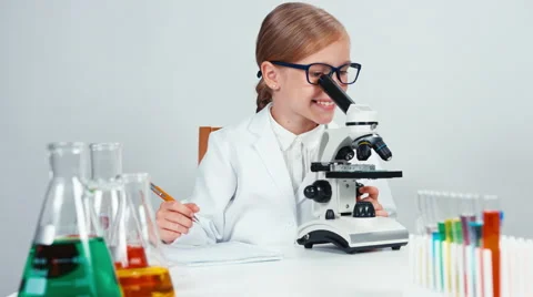 Portrait chemist looking in microscope and smiling at camera. Thumb up. Ok Stock Footage 65260566