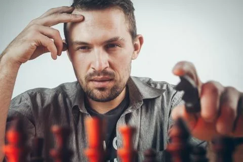 Portrait of a chess player thinking through the next move Stock Photos