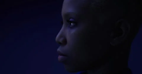 Portrait of a child with a contemplative expression against a dark background Stock Illustration