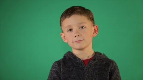 Portrait of a child on a green background Stock Footage 84658118