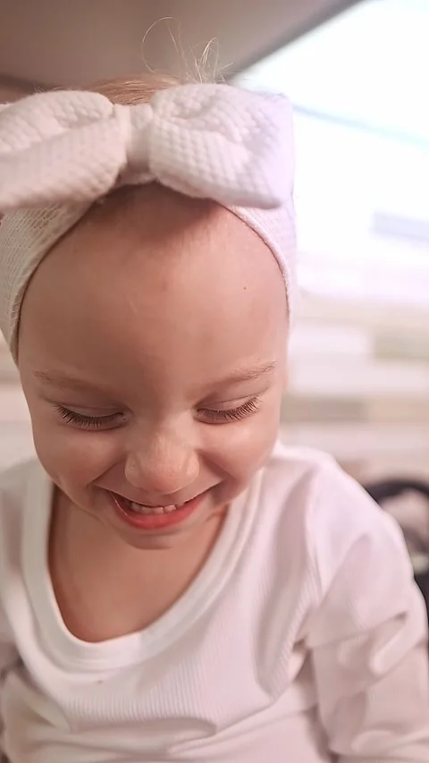 Portrait of a child in a kitchen apron baking gingerbread cookies with parents, Stock Footage 288450688