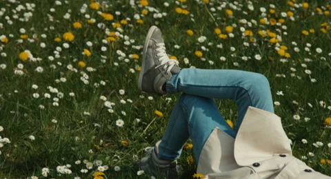 Portrait child lying on the grass. Looking at camera Video stock 49675958