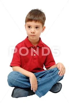 Portrait of child sitting on floor isolated on white background Stock Photos