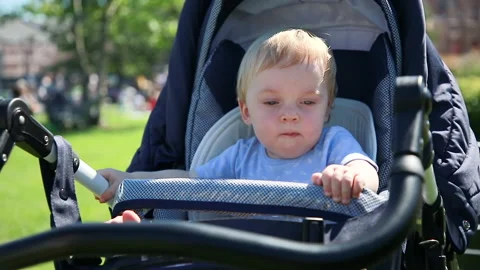 Portrait of a child in a stroller Stock Footage 137023691