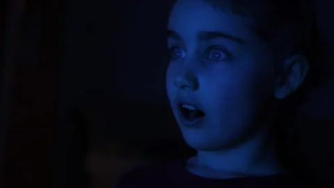 Portrait Child While Watching TV. Scared Girl Watch Television in Living Ro.. Video stock 336022521
