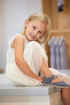 Portrait, children and shoes with a girl customer shopping in a mall or retail Stock Photos