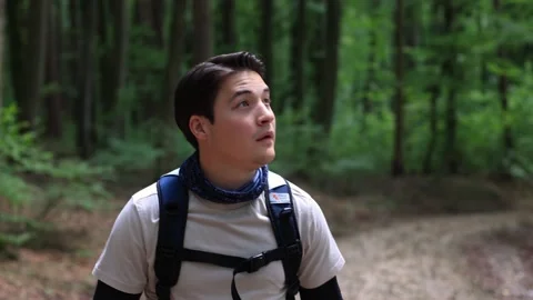 Portrait close-up guy walks in forest and holds on backpack.hike in the forest Stock-Footage 259489468