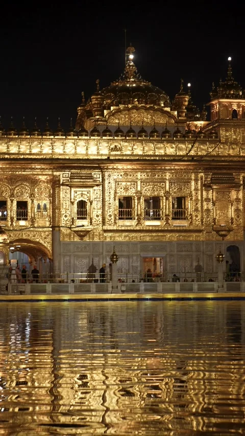 Portrait Composition of Golden Temple with Water Reflection at Night Stock Footage 331341129