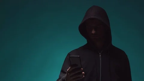 Portrait of computer hacker in hoodie. Obscured dark face. Data thief, internet Stock Footage 117864189