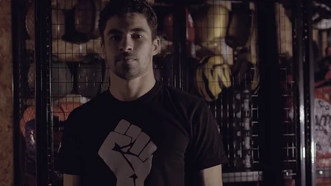 Portrait of a concentrated boxer working out actively. Видео 76915184