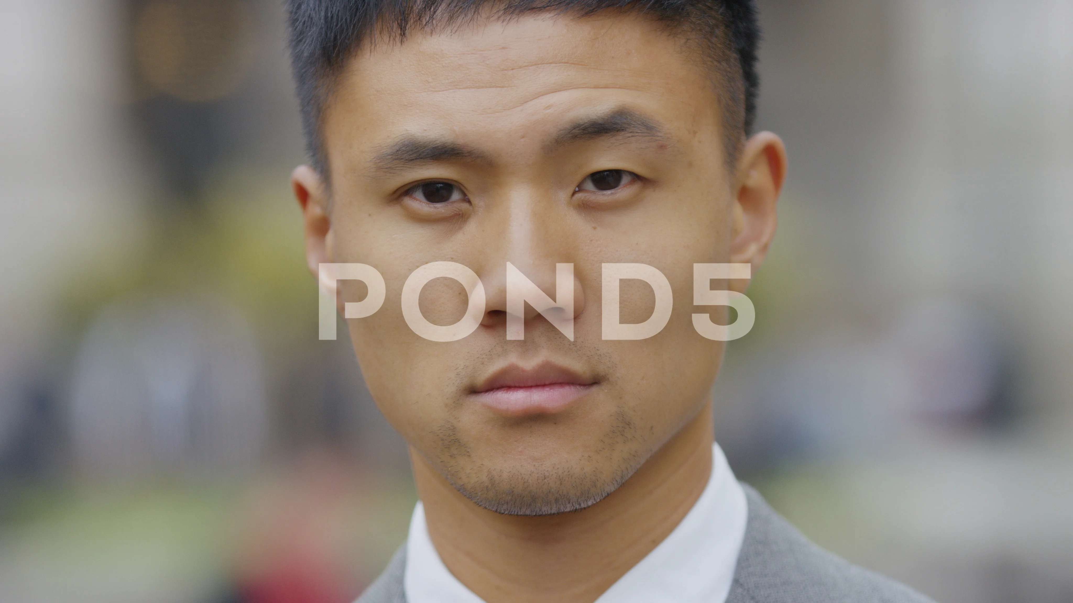 Portrait of confident Asian professional male looking to camera