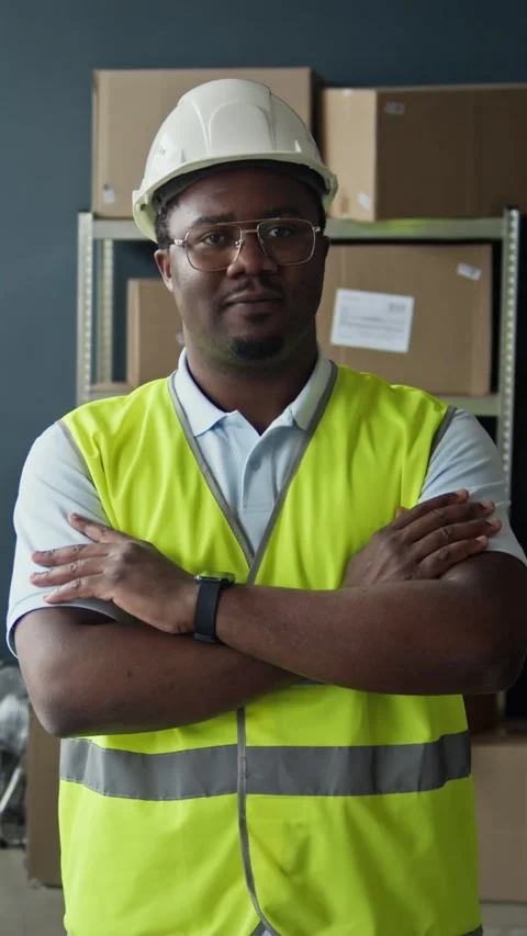Portrait of Confident Black Man Warehouse Worker Standing with Arms Crossed Stock Footage 337305249