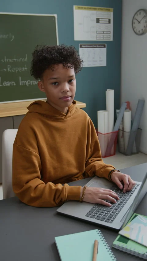 Portrait of Confident Black Schoolboy Working on Laptop at Coding Lesson Stock Footage 318718467