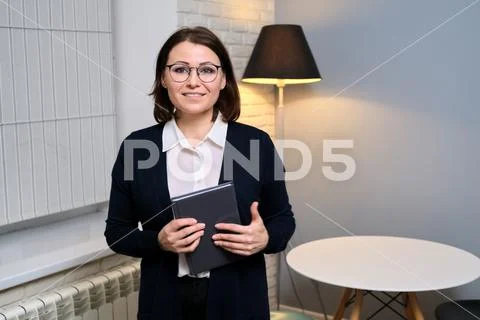 Portrait of confident business middle aged counselor woman, lawyer, advisor Stock Photos
