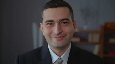 Portrait of confident businessman posing for camera and smiling while standing Stock Footage 168518855