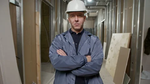 Portrait of Confident Engineer in Hardhat Posing for Camera at Renovation Space Stock Footage 308921447