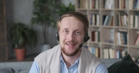 Portrait of confident guy in headset call to friends talking online video lesson Stock Footage 165871866