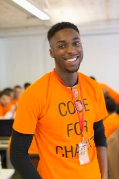 Portrait confident hacker coding for charity at hackathon Stock-Fotos