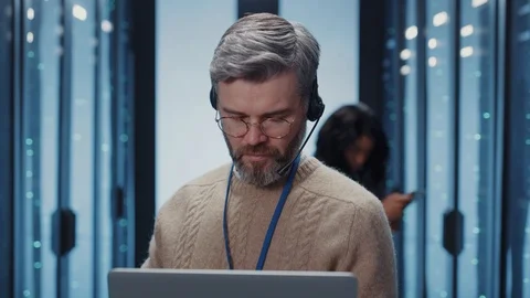 Portrait confident IT administrator working at operational database storage Stock Footage 125404899
