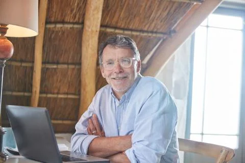 Portrait confident senior man using laptop Stock Photos