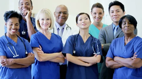Portrait of confident team multi ethnic male female staff in medical centre Stock Footage 53896499
