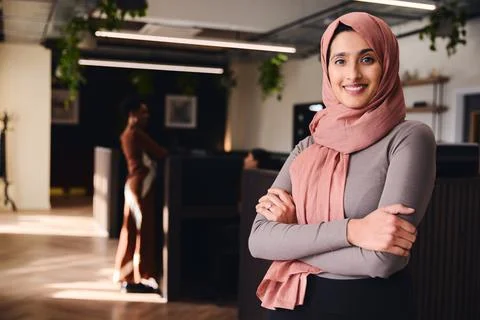 Portrait of confident young Middle Eastern woman smiling and looking at camer Stock Photos