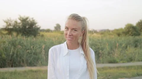 Portrait. Confidently looking at the camera A young adult European girl  Stock Footage 158778709