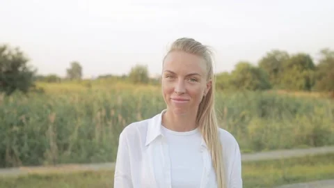 Portrait. Confidently looking at the camera A young adult European girl  Stock Footage 158778854