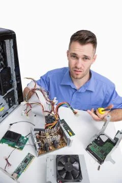 Portrait of confused computer engineer with cpu parts Foto stock