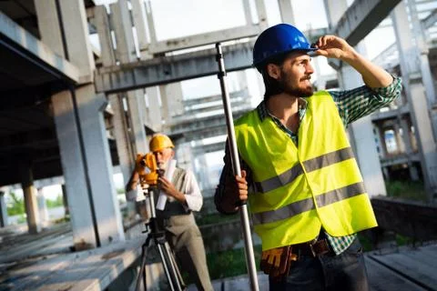 Portrait of construction architects, engineers working on building site Fotos de archivo