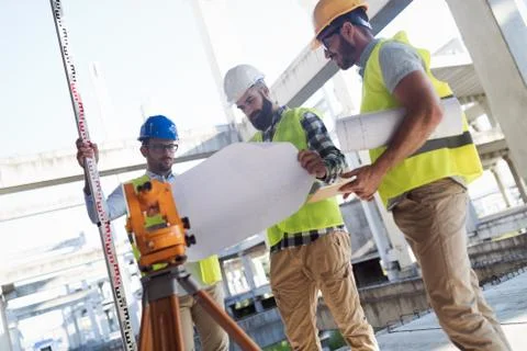 Portrait of construction engineers working on building site Fotos de archivo