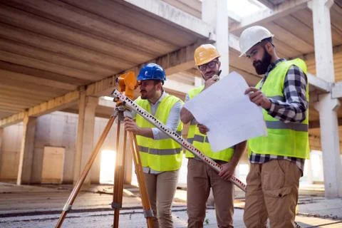 Portrait of construction engineers working on building site Fotos de archivo