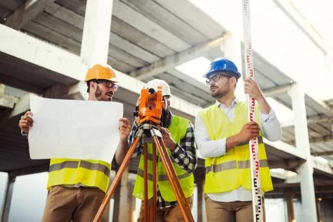 Portrait of construction engineers working on building site Fotos de archivo