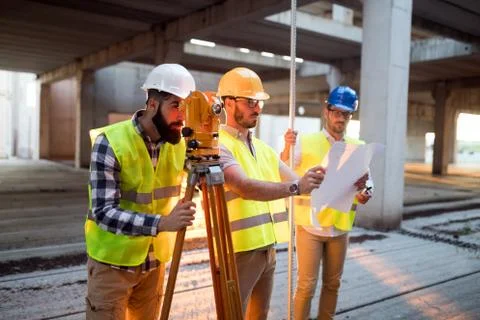 Portrait of construction engineers working on building site Fotos de archivo