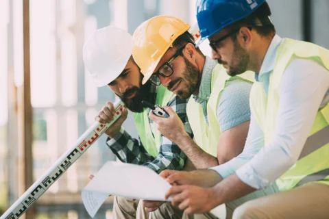 Portrait of construction engineers working on building site Fotos de archivo