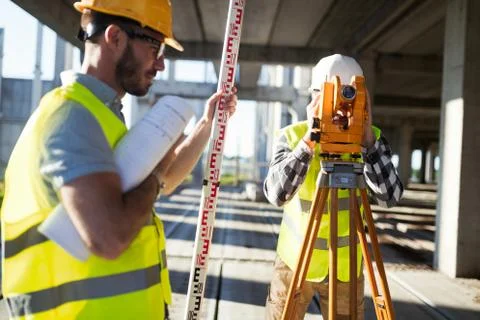 Portrait of construction engineers working on building site Fotos de archivo