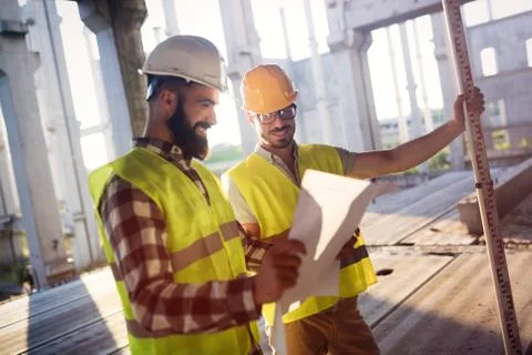 Portrait of construction engineers working on building site Fotos de archivo