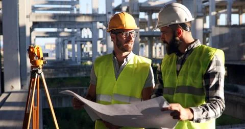 Portrait of construction engineers working on building site Fotos de archivo