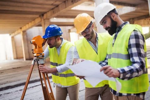 Portrait of construction engineers working on building site Fotos de archivo