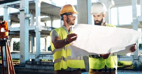 Portrait of construction engineers working on building site Fotos de archivo