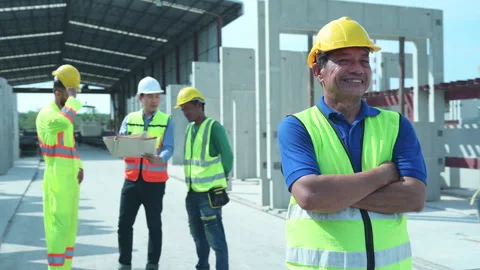 Portrait of construction supervisor and construction engineer working Stock Footage 255351429