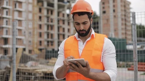 Portrait of construction worker on building site with tablet looking at the Stock Footage 109635058