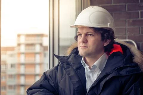 Portrait Of Construction Worker On Building Site. Soft focus, toned. Stock Photos