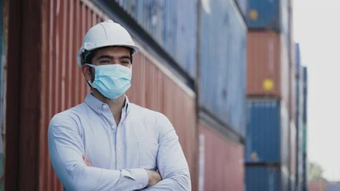 Portrait of a construction worker wearing a hard hat and mask Stock Footage 135521204