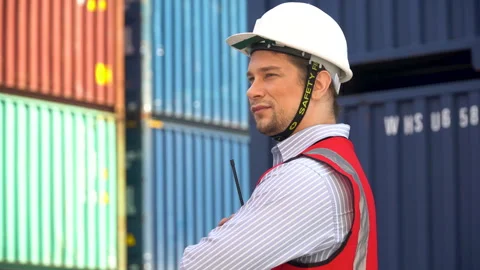 Portrait  of container worker confident and smiling standing at warehouse l.. Stock Footage 241713879