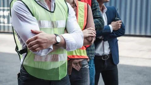 Portrait of Containers Ship Engineer Control Team Import/Export Standing Agai Foto stock