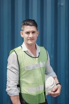 Portrait of Containers Ship Engineer Control Import/Export Standing Against B Foto stock